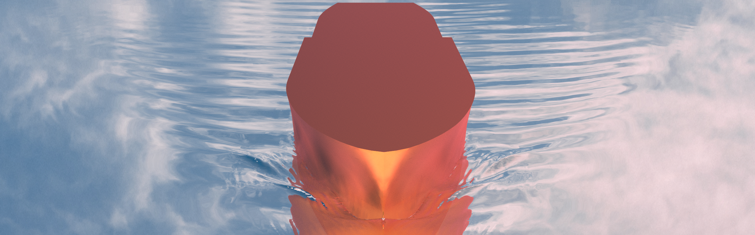 Red model of boat floating across calm sea